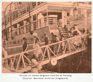 Group of Indian Migrant Coolies exiting boat in a line on a steel bridge. 