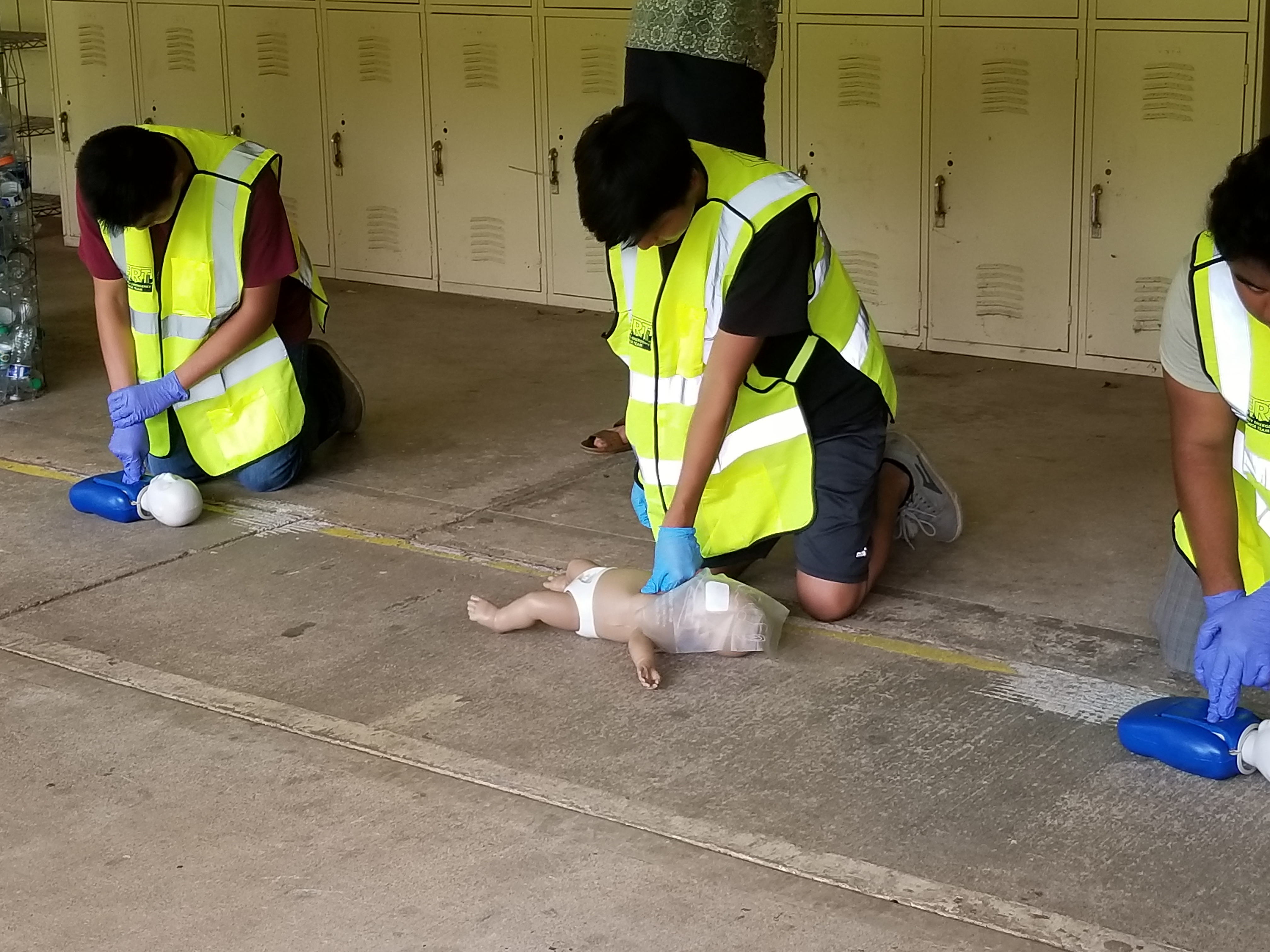 High School Jr. ROTC Cadets learning CPR