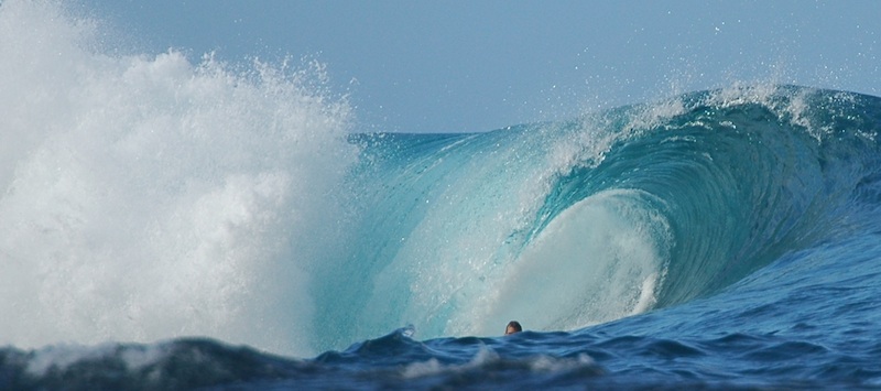 <p><strong>Fig. 4.1.</strong> A surfer emerging from a plunging, barreling wave</p>