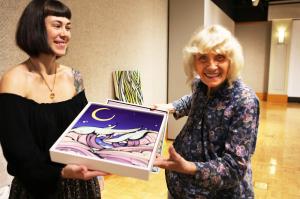 Bethany Georges and Toni Martin receive art for HomeGrown