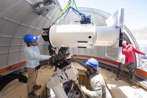 Chilean engineers and astronomers installing the ATLAS telescope at El Sauce Observatory.