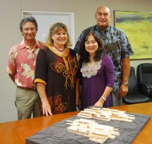 Guy Lam, Beth Sanders, Noreen Yamane and Rockne Freitas with a model of the campus