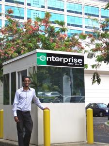 Enterprise Rent-A-Car kiosk behind POST Building on East-West Road