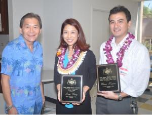 Hawai'i CC Assistant Professor Anne Chung (center) accepts the HBEA Educator of the Year Award.