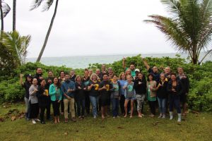 TRHT executive leadership and community cohort standing together at the oceanfront at Punalu‘u.