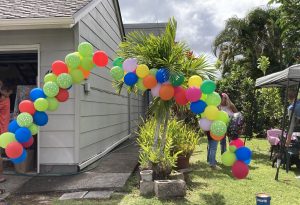 Image of a balloon rainbow at a graduation celebration