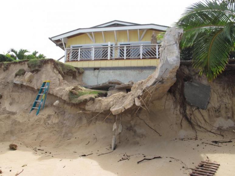 <p>Fig. 2.&nbsp;Intense waves and high sea level events contribute to coastal erosion, which threatened this house on the North Shore of O‘ahu.</p>
