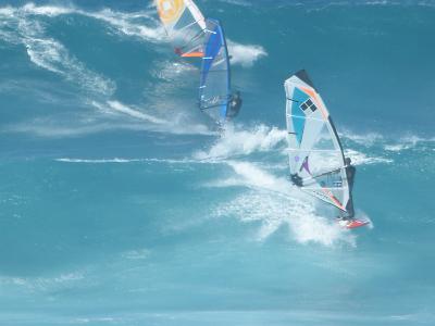 <p>Fig. 8. These wind surfers off Molokaʻi must pay particular attention to wind conditions as it influences their speed and wave conditions.</p>
