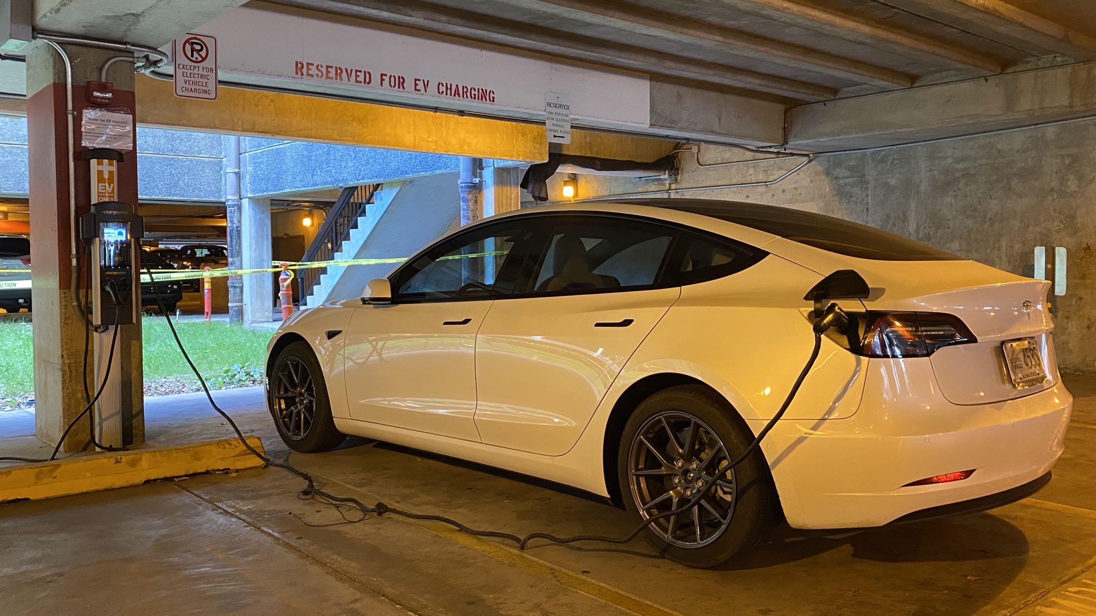 Tesla at EV charging station