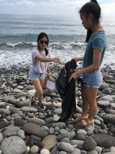 Bagging trash at 2019 Beach Clean Up