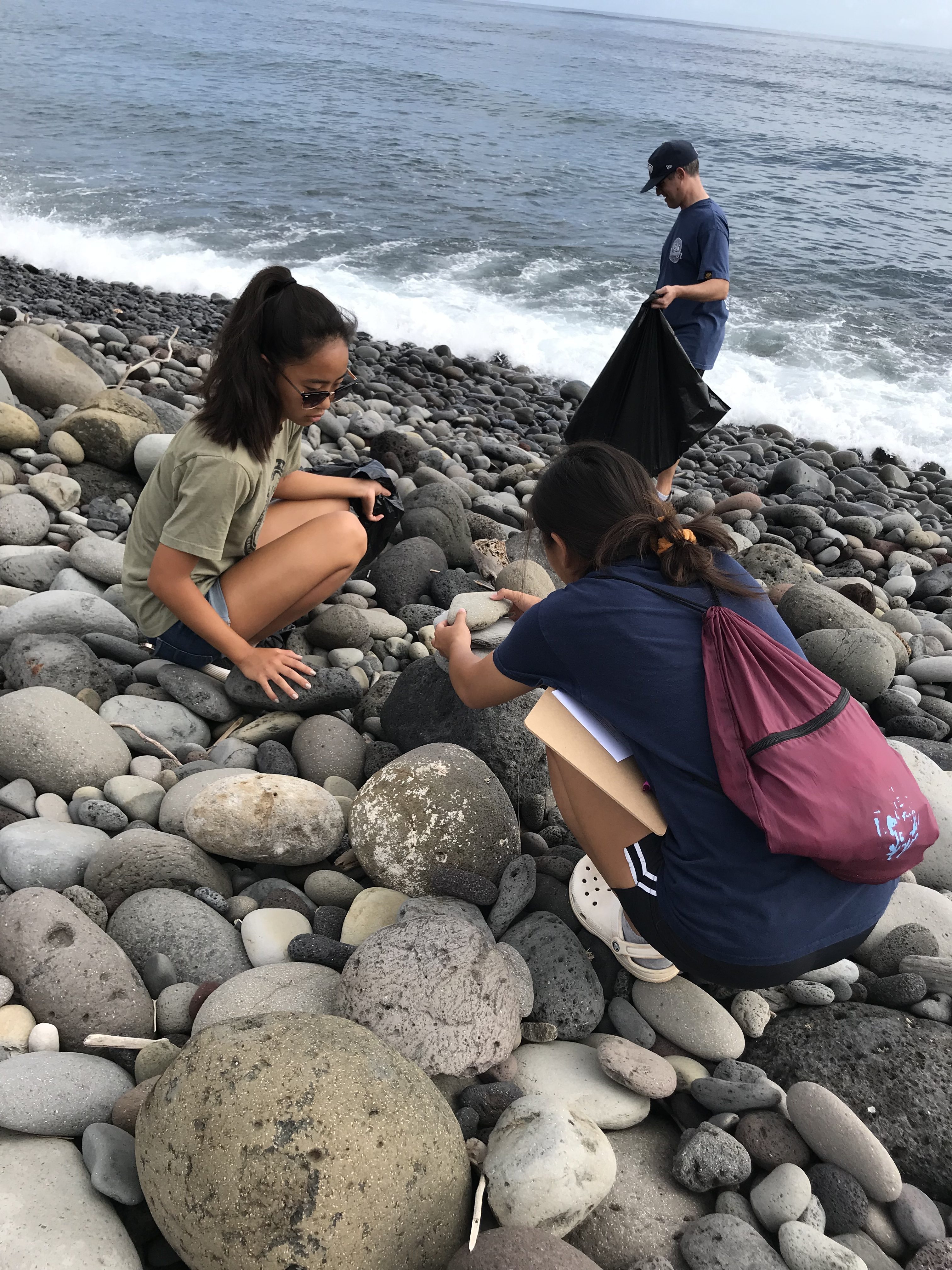 Bagging trash at 2019 Beach Clean Up