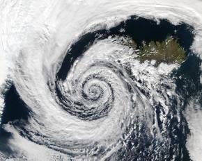 <p><strong>Fig. 3.9.</strong> (<strong>A</strong>) A low-pressure system spiraling counter-clockwise over Iceland in the Northern Hemisphere.</p>
