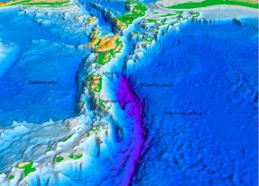 <p><strong>Fig. 7.28.</strong> In this computer model of the ocean floor north of Puerto Rico, Caribbean Sea, western central Atlantic ocean basin, the purple areas indicate the Puerto Rico Trench, 8.6 km below the ocean surface. It is the deepest point in the Atlantic ocean basin.</p>
