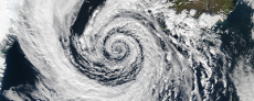 Image over the top of a hurricane illustrating the counter clockwise vortex of the clouds