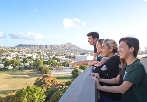 Students On Campus With Diamondhead In Background