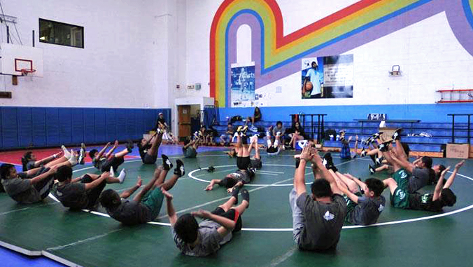 students exercises in gym