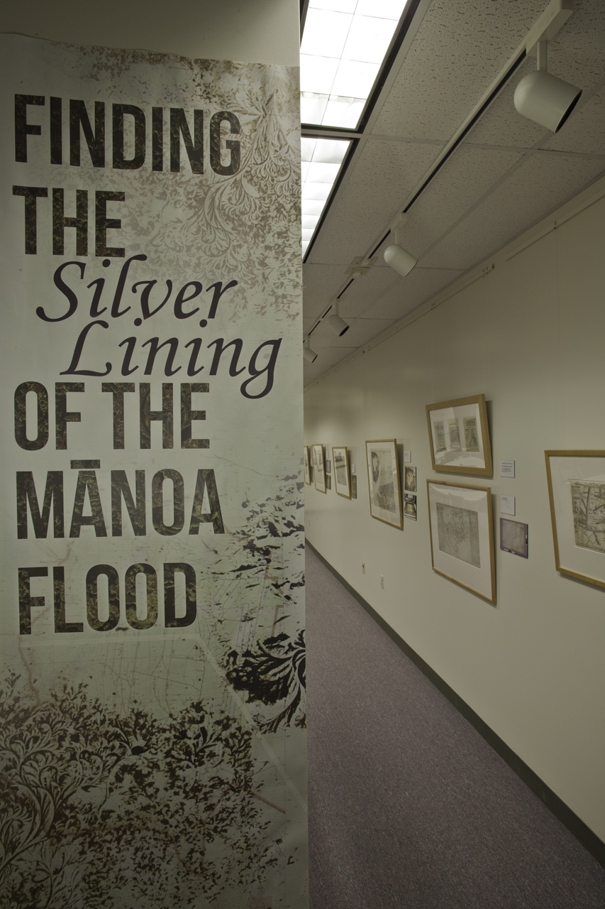 In-situ photographs of the "Finding the Silver Lining of the Manoa Flood" exhibit in the Moir Reading Room.