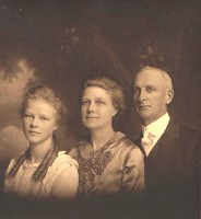 Dr. Romanzo Colfax Adams, his wife, Nellie May Cronk Adams, with their daughter Katherine Adams.