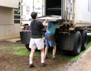 Staff loading materials onto trucks