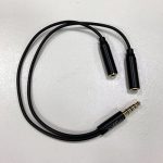 Image of splitter for 3.5mm headphone jack, allowing two headphones to connect to one audio feed.
