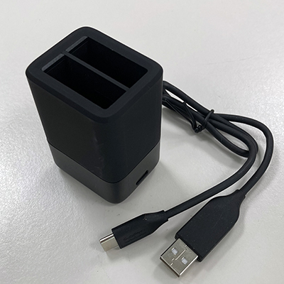 Image of battery charger for GoPro, showing USB wire