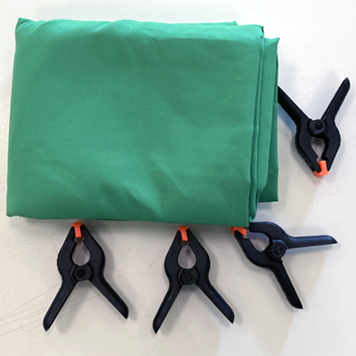picture of greenscreen sheet with clips