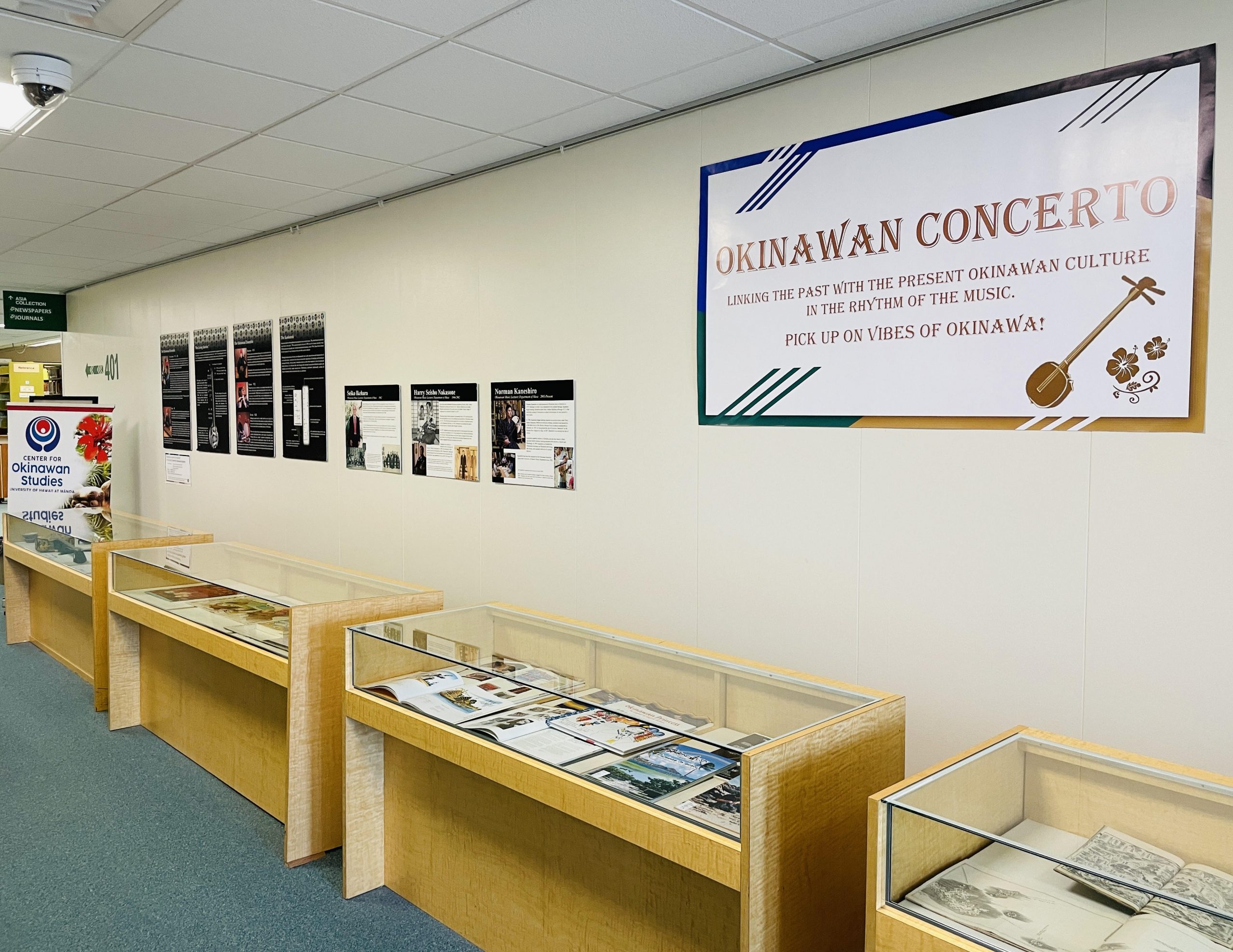 Okinawan Concerto Exhibit Banner and view of display cases