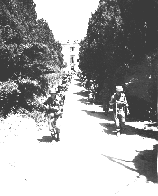 2nd Lt. Masanao Otake leading his platoon from Orciano, Italy