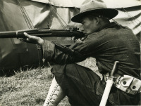 Selective service man holding a rifle