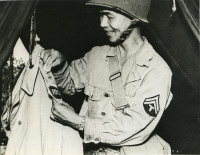 Soldier fixing a uniform