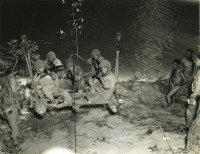 Soldiers preparing to cross a stream