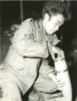 Soldier preparing artillery shell