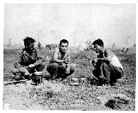 Soldiers eating chow in the field