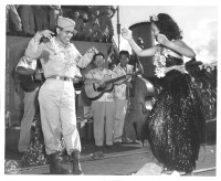 Returning soldier does the hula, August 1946