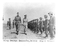 King George inspects soldiers at Cecina, Italy