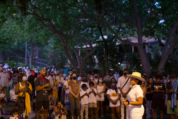 Dr. Akiemi Glenn addressing a group gathered to observe Juneteenth at Mākālei Park in Honolulu in 2020