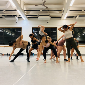 A Group Of Dancers Rehearsing In The Dance Studio