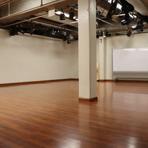 Empty Room With Wood Laminate Floor And A Roof Support Mid Room.