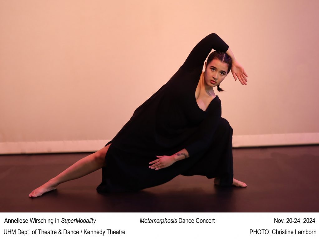 Female dancer in long sleeved black costume with strong side lung with one arm over head.