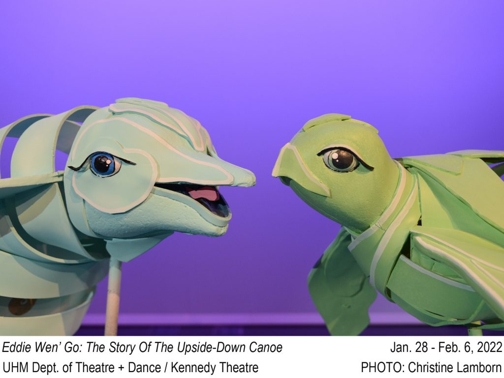 IMAGE: Photo of Dolphin and Sea Turtle puppets against purple background. TEXT: Eddie Wen' Go: The Story of the Upside-Down Canoe. Jan. 28 - Feb. 6, 2022. UHM Dept. of Theatre + Dance / Kennedy Theatre. PHOTO: Christine Lamborn.