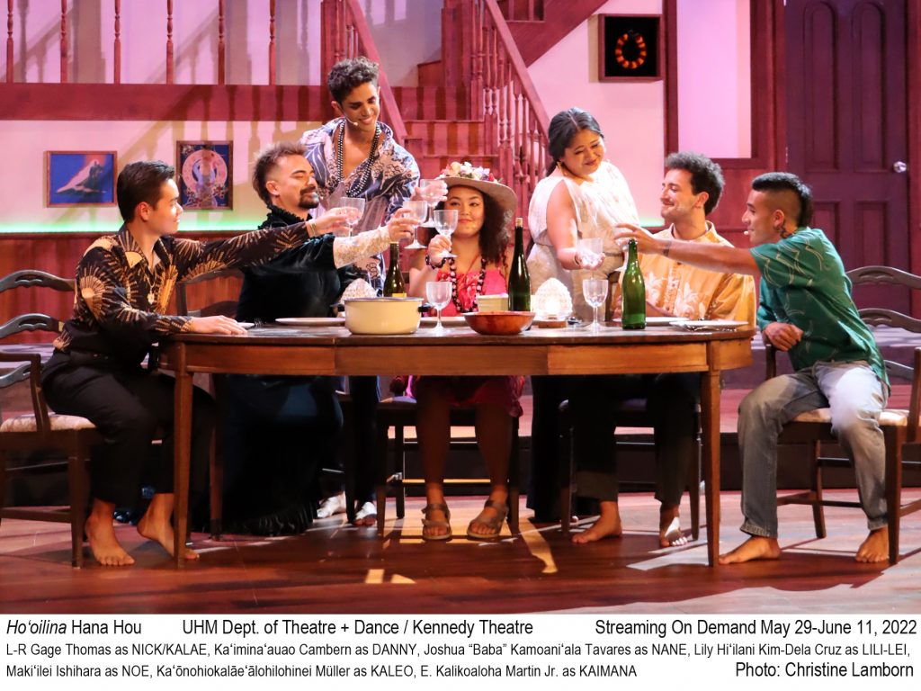 Photo of actors around dining room table on stage mid-cheers. Text below image reads " Ho'oilina Hana Hou. UHM Dept. of Theatre + Dance / Kennedy Theatre. Streaming On Demand May 29-June 11, 2022."