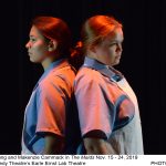 Two performers in maid uniforms. Joyy Young and Makenzie Cammack in "The Maids" Nov. 14-23, 2019 at UM Kennedy Theatre's Earle Ernst Lab Theatre. Photo by John Wells