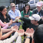 Raedelle Van Fossen leads a group in a watershed activity