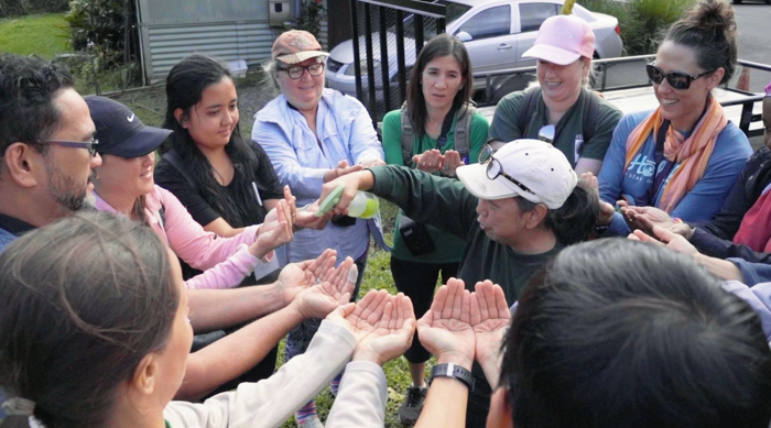 Raedelle Van Fossen leads a group in a watershed activity