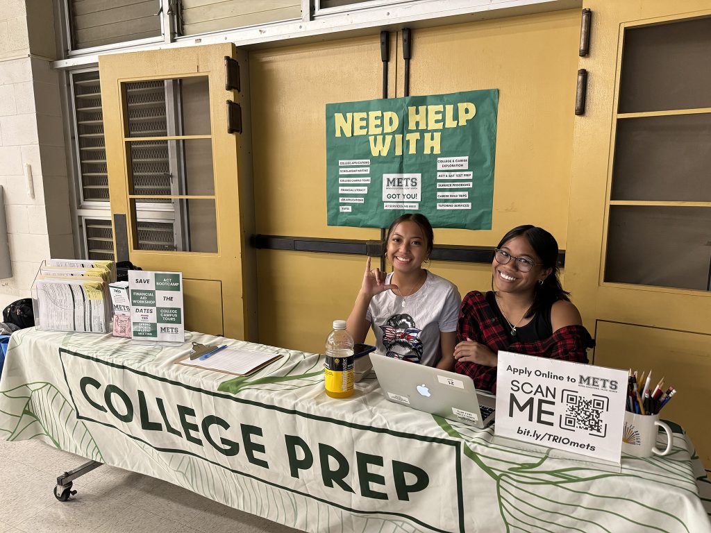 NHIS METS students who were helping with managing the METS booth during Senior ʻOhana Night poses for a picture.