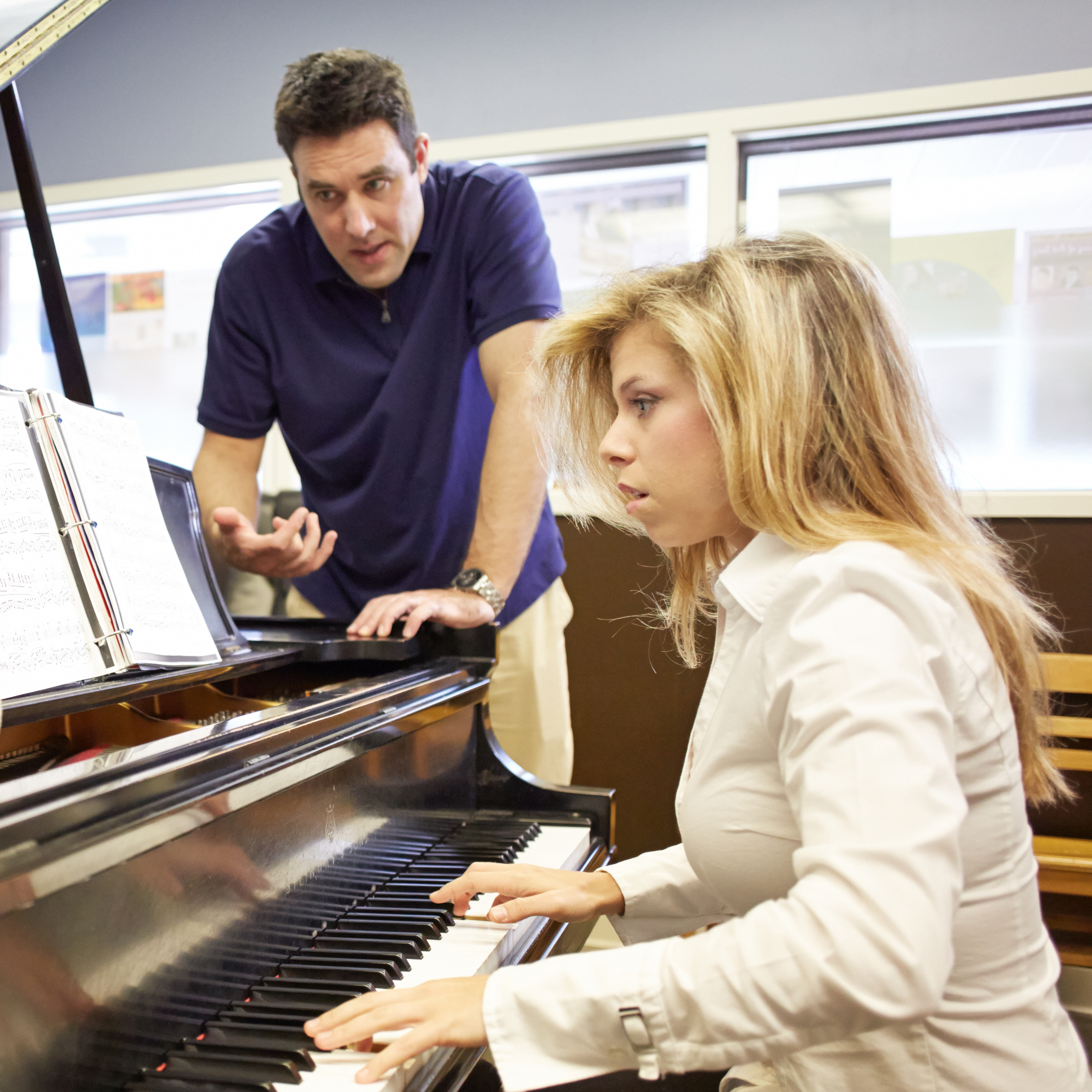 Piano professor Dr. Jonathan Korth teaches a piano student in his studio.