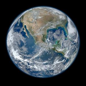 The thin, critical envelope of the Earth’s atmosphere is just visible on this global image.
