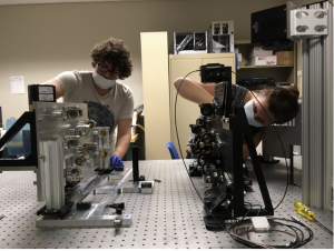 Charlotte Bond (right) and Jacques Robert Delorme working on new camera at IfA’s Hilo facility.