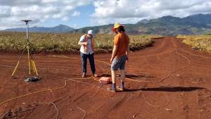 Researchers conduct geophysical survey taking gravity and audiomagnetotelluric measurements.