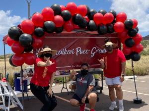 Volunteers celebrate graduates at the UH West Oʻahu Drive-Thru Celebration.